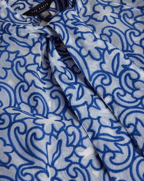 MELODIY-Tops-Add a touch of texture and colour to your outfit with the dreamy MELODIY top. Its paisley design is sure to stand out, while puff sleeves and a neck tie enhance the silhouette. Boxy fit top Semi sheer Jacquard paisley design Short puff sleeves Oversized neck tie High neck Awuoi is 5'10.5" / 1.79m and wears Bright Blue in a Ted size 1- Ted Baker Romania